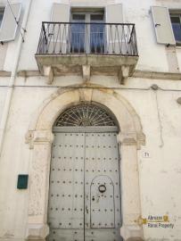 Large historic palazzo with garden and olive grove, for sale.
