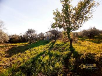 Cheap ruin with land and panoramic view near the coast for sale.