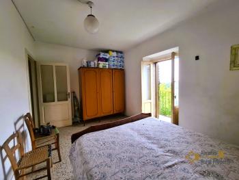 Two-bedroom town house with garage, cellar and 400 sqm of land. Tornareccio Img17