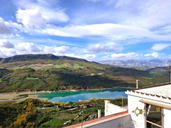 Recently restored two-bedroom town house with fantastic lake view terrace. Colledimezzo