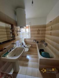 Two-bedroom stone house in habitable conditions with two cellars and outbuilding/garage. Guilmi Img17