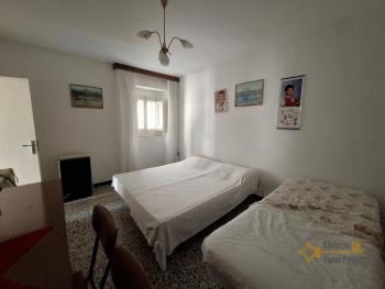 Two-bedroom stone house in habitable conditions with two cellars and outbuilding/garage. Guilmi Img9