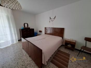 Two-bedroom stone house in habitable conditions with two cellars and outbuilding/garage. Guilmi Img11