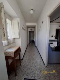 Two-bedroom stone house in habitable conditions with two cellars and outbuilding/garage. Guilmi Img4