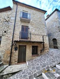 Traditional two-bedroom stone house with star-vaulted ceilings and panoramic balcony. Guilmi