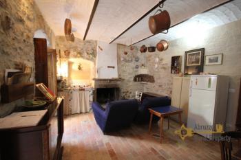 Completely restored stone house with small garden for sale.